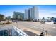 Street view of a beachside property with a view of the ocean and surrounding high-rise buildings at 2600 S Ocean Blvd. # 101, Myrtle Beach, SC 29577