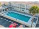 Aerial view of the community pool with clear blue water, surrounded by the building at 2600 S Ocean Blvd. # 101, Myrtle Beach, SC 29577