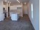 Open-concept kitchen area with a stainless steel appliance package, an island, and hardwood floors at 267 Warner Crossing Way, Loris, SC 29569