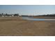 Scenic view of a pond in the community, surrounded by lush landscaping and walking trails at 267 Warner Crossing Way, Loris, SC 29569