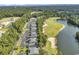 Aerial view of residential property next to golf course and lake, showcasing serene recreational setting at 298 Pinehurst Ln. # 10-J, Pawleys Island, SC 29585