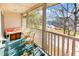 Comfortable balcony space with water view, chairs, seating, and trunk-style table at 298 Pinehurst Ln. # 10-J, Pawleys Island, SC 29585