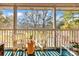 Comfortable balcony space with seating, side table and a treetop view at 298 Pinehurst Ln. # 10-J, Pawleys Island, SC 29585