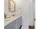 Bathroom featuring double sinks, modern fixtures, and a stylish bamboo-framed mirror at 298 Pinehurst Ln. # 10-J, Pawleys Island, SC 29585