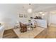 Bright dining area featuring hardwood floors, a modern light fixture and seating for four guests at 298 Pinehurst Ln. # 10-J, Pawleys Island, SC 29585