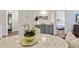 Bright dining area featuring a marble-topped table and seamless access to the living spaces in this open-concept layout at 298 Pinehurst Ln. # 10-J, Pawleys Island, SC 29585