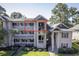 Multi-story condo with private balcony overlooking landscaped grounds and mature trees in a serene setting at 298 Pinehurst Ln. # 10-J, Pawleys Island, SC 29585