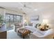 Bright living room with a large balcony, comfortable seating, and stylish decor that creates a welcoming atmosphere at 298 Pinehurst Ln. # 10-J, Pawleys Island, SC 29585