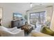 Cozy living room with vaulted ceilings, a ceiling fan, and lots of natural light at 298 Pinehurst Ln. # 10-J, Pawleys Island, SC 29585