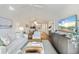 Bright living room featuring hardwood floors, vaulted ceilings and a comfortable seating area at 298 Pinehurst Ln. # 10-J, Pawleys Island, SC 29585