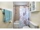 Bathroom with a combination bathtub and shower with a floral curtain at 309 W Bond St., Marion, SC 29571