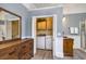 Bathroom featuring a laundry closet with a washer and dryer, vintage furniture, and wood-look flooring at 309 W Bond St., Marion, SC 29571