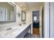 Bathroom featuring a double sink vanity with tile backsplash and updated fixtures at 309 W Bond St., Marion, SC 29571