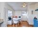 Bright dining area with white table, chairs, and cushioned bench seating at 309 W Bond St., Marion, SC 29571