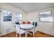 Cozy dining area with white table, cushioned bench and lots of sunlight at 309 W Bond St., Marion, SC 29571