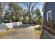 Spacious driveway with a privacy fence and lush greenery at 309 W Bond St., Marion, SC 29571