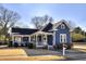 Charming blue home with inviting front porch and manicured lawn at 309 W Bond St., Marion, SC 29571