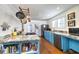 Spacious kitchen featuring blue cabinets, modern appliances, and granite countertops at 309 W Bond St., Marion, SC 29571