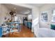 Open kitchen design with blue cabinets, granite counters, and seamless dining area at 309 W Bond St., Marion, SC 29571