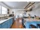 Updated kitchen with stainless steel appliances, stone countertops, and center island at 309 W Bond St., Marion, SC 29571