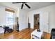 Living room with hardwood floors, closet space, and a ceiling fan at 309 W Bond St., Marion, SC 29571