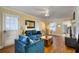 Inviting living room with blue sofas, wood floors, and bright natural light at 309 W Bond St., Marion, SC 29571