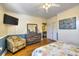 View of the main bedroom featuring a chair and a view of an ensuite bathroom at 309 W Bond St., Marion, SC 29571