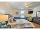 Main bedroom with colorful decor, ceiling fan, TV, and lots of natural light from the window at 309 W Bond St., Marion, SC 29571
