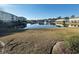 Scenic view of a pond reflecting nearby condos, featuring a charming fountain and expansive green space at 330 Kiskadee Loop # A, Conway, SC 29526