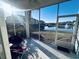 Relaxing sunroom view overlooks a serene pond with a fountain and nearby condos on a sunny day at 330 Kiskadee Loop # A, Conway, SC 29526