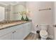 Clean bathroom featuring granite countertops, undermount sink, and wood-look floors at 3304 Palm St., North Myrtle Beach, SC 29582