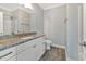 Bright bathroom features a granite countertop, undermount sink, and wood-look floors at 3304 Palm St., North Myrtle Beach, SC 29582