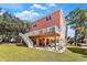Coastal home exterior showcasing a raised stilt foundation and spacious deck with lovely view at 3304 Palm St., North Myrtle Beach, SC 29582