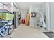 Organized garage area featuring ample storage, shelving units, and a variety of household items at 3304 Palm St., North Myrtle Beach, SC 29582