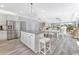 Open floor plan showing kitchen island with seating opening into the dining and living room area at 3304 Palm St., North Myrtle Beach, SC 29582