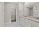 Bathroom features a double sink vanity with granite countertops, a large mirror, and tile flooring at 344 Kiskadee Loop # A, Conway, SC 29526