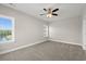 Sunlit bedroom featuring carpet, ceiling fan, and two windows letting in natural light at 344 Kiskadee Loop # A, Conway, SC 29526