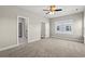 Spacious bedroom featuring carpet, a ceiling fan, and two doorways leading to other rooms at 344 Kiskadee Loop # A, Conway, SC 29526