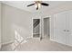 Neutral bedroom includes ceiling fan, carpet, and two doors leading to other spaces at 344 Kiskadee Loop # A, Conway, SC 29526