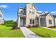 Charming two-story townhome with a combination of brick and siding and a well-manicured lawn and walkway at 344 Kiskadee Loop # A, Conway, SC 29526