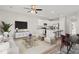 Bright open-concept living area features a modern kitchen with white cabinets and an eat-in island at 344 Kiskadee Loop # A, Conway, SC 29526