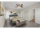 Cozy bedroom features a ceiling fan, neutral paint, and a private ensuite bathroom at 344 Kiskadee Loop # A, Conway, SC 29526