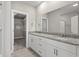Bathroom features double sink vanity with granite countertop and access to walk-in closet and shower stall at 344 Kiskadee Loop # B, Conway, SC 29526