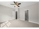 Bright bedroom featuring carpet, ceiling fan, and en suite bath with a shower at 344 Kiskadee Loop # C, Conway, SC 29526