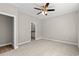 Spacious bedroom with neutral tones, carpet flooring, and ceiling fan at 344 Kiskadee Loop # C, Conway, SC 29526