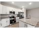 Modern kitchen features granite countertops and stainless steel appliances at 344 Kiskadee Loop # C, Conway, SC 29526