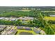 An aerial view showing the community, surrounded by mature trees and a picturesque pond at 344 Kiskadee Loop # D, Conway, SC 29526