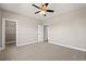 Neutral bedroom featuring a ceiling fan, carpet flooring, and access to a bathroom and closet at 344 Kiskadee Loop # D, Conway, SC 29526