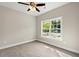 Neutral bedroom with a ceiling fan and a large window offering a view of the outdoors at 344 Kiskadee Loop # D, Conway, SC 29526