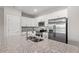 Bright kitchen featuring stainless steel appliances, granite countertops and island with wood floors at 344 Kiskadee Loop # D, Conway, SC 29526